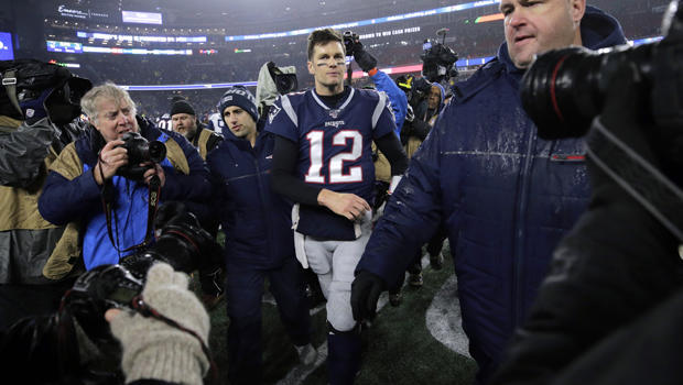 New England Patriots quarterback Tom Brady leaves the field after losing an NFL wild-card playoff football game to the Tennessee Titans