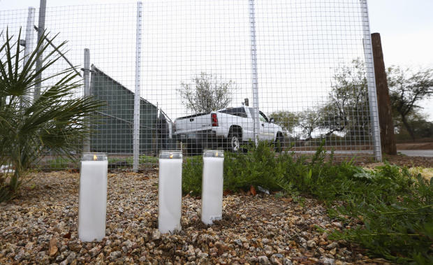 A makeshift memorial is set up near a home where a Phoenix woman was arrested on suspicion of killing her three children, who were found dead inside the family's home, January 21, 2020, in Phoenix. 