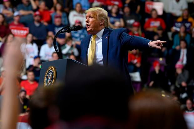 US President Donald Trump gestures as he addresses a "Keep America Great" rally in Colorado Springs