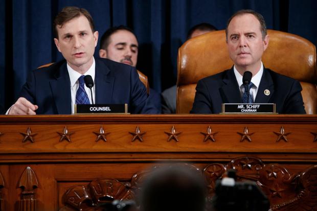 Democratic Chairman of the House Permanent Select Committee on Intelligence Adam Schiff (R) listens as Democratic legal counsel Daniel Goldman (L) questions Director for European Affairs of the National Security Council