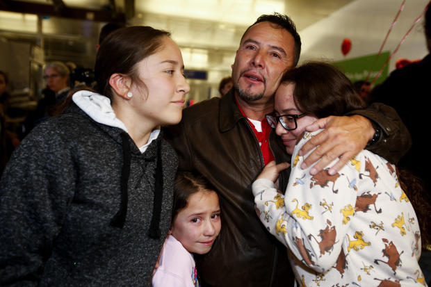 Esvin Fernando Arredondo of Guatemala reunites with his daughters Andrea