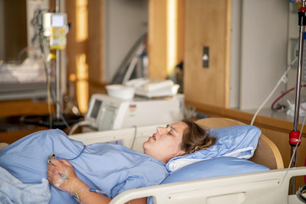 Young pregnant woman in the hospital in contractions and ready to delivery a baby.
