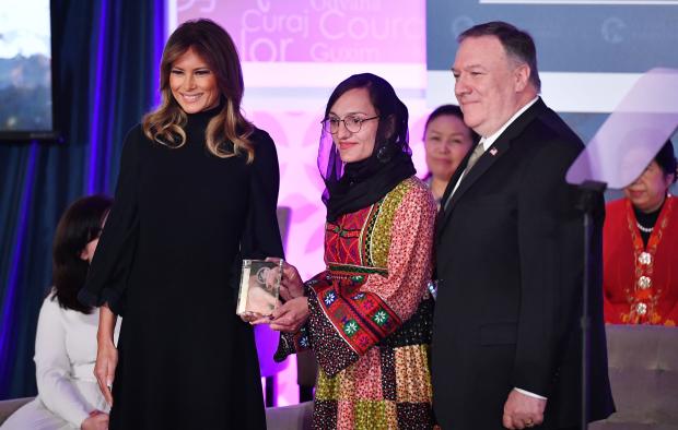 International Women of Courage (IWOC) Award recipient Zarifa Ghafari of Afghanistan poses with US Secretary of State Mike Pompeo (R) and First Lady Melania Trump at the State Department in Washington