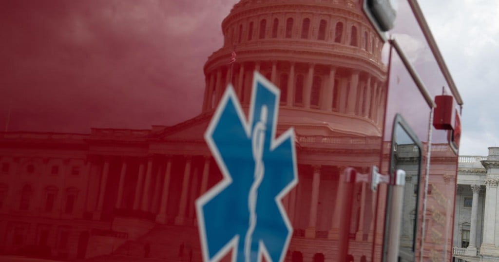 An ambulance is seen outside the US Capitol prior to the Senate holding a pro forma session where the Senate planned to vote on a nearly $500 billion package to further aid small businesses