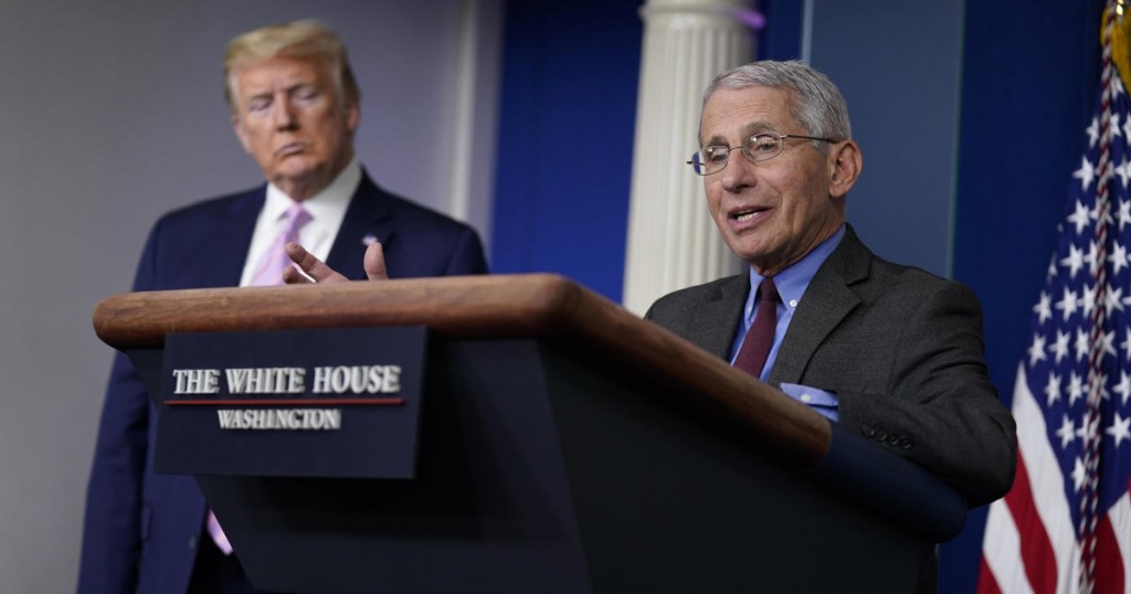 President Donald Trump listens as Director of the National Institute of Allergy and Infectious Diseases Dr. Anthony Fauci speaks during a coronavirus task force briefing at the White House