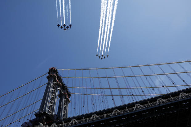 U.S. Navy Blue Angels and U.S. Air Force Thunderbirds demonstration teams fly over Manhattan bridge as part of the "America Strong" tour of U.S. cities to honor first responders and essential workers during the outbreak of the coronavirus disease (COVID-19) in Brooklyn