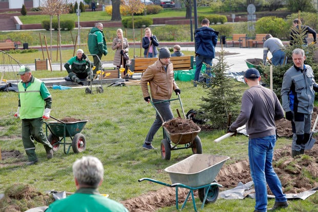 People take part in "Subbotnik", a day of volunteer community work on Saturday, as the spread of the coronavirus disease (COVID-19) continues, in Minsk 