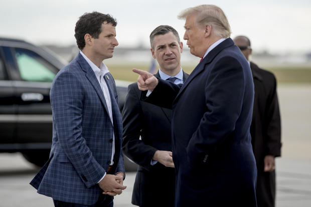 President Donald Trump is greeted by Rep. Trey Hollingsworth