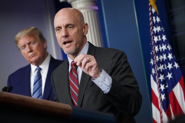 FDA Commissioner Dr. Stephen M. Hahn speaks as US President Donald Trump listens during the daily briefing on the novel coronavirus