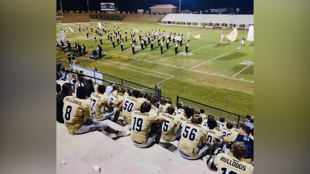 Lamar County football team honors band from the stands