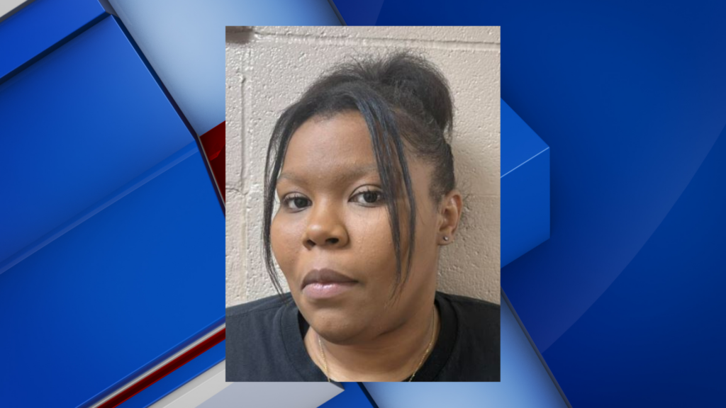 Louisville woman turns herself in after allegedly punching teacher