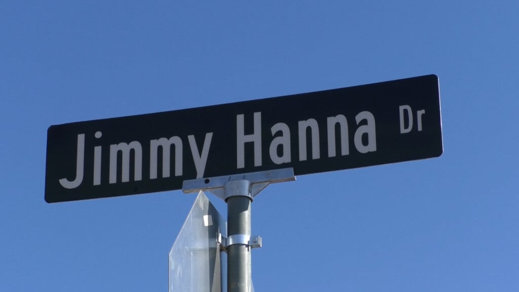 People dedicate road sign to late part owner of Hanna Contracting