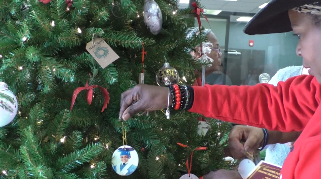 Gun violence victim families place ornaments to honor loved ones