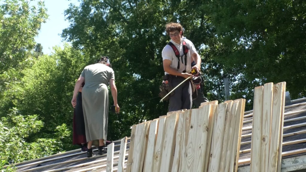 Volunteers travel miles to help Columbus man fix his home