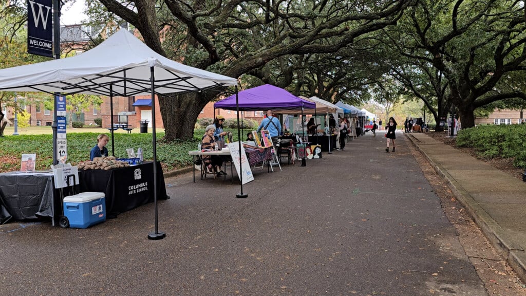 Street Under Oaks Lined With Art Vendors On Muw Campus