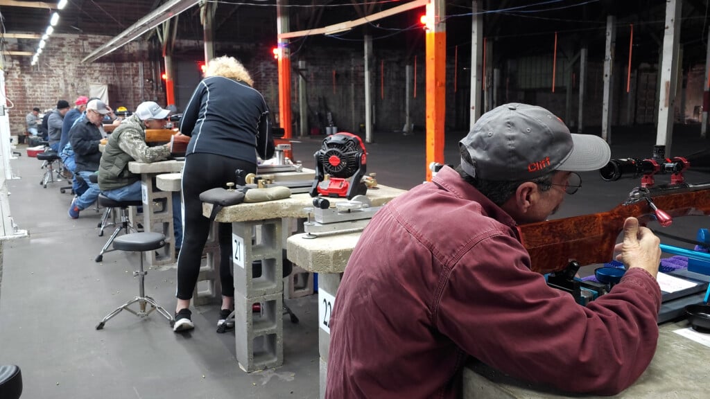 Row Of People Shooting Rifles