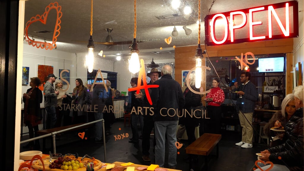 Window Of Starkville Area Arts Council With People Inside