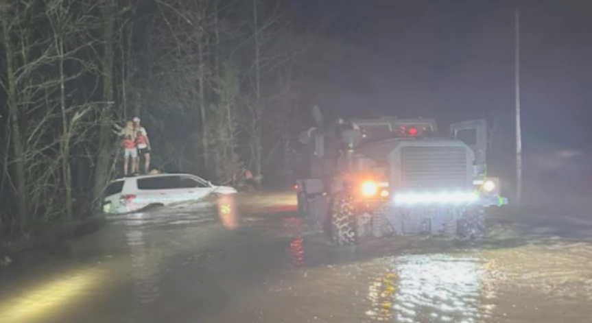 Rescue volunteers perform water rescues after storm in Monroe