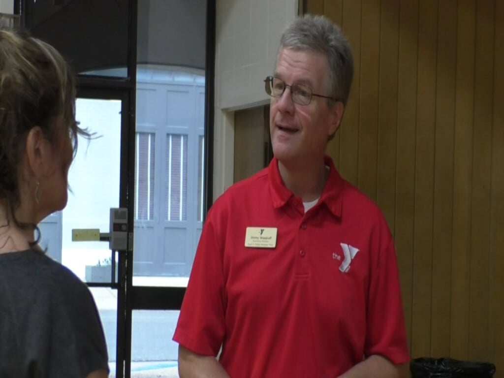 A local YMCA director is passing the baton