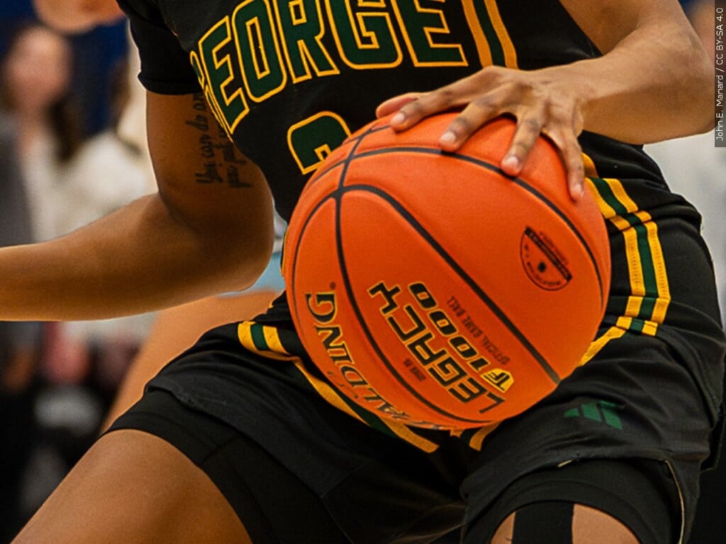 person dribbling a basketball