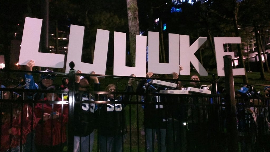 Panthers fans hold a 'Luuuke' sign for the teams arrival back to Charlotte.