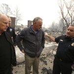FILE - In this Wednesday, Nov. 14, 2018 file photo, Scott Upton, right, the chief of the Northern Region for the California Department of Forestry and Fire Protection briefs California Gov. Jerry Brown, Federal Emergency Management Agency Director Brock Long, second left, and U.S. Secretary of the Interior Ryan Zinke, third left, during a a tour of the fire ravaged Paradise Elementary School in Paradise, Calif. Zinke will be leaving the administration at year's end, Trump said Saturday, Dec. 15. (AP Photo/Rich Pedroncelli, File)