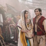 This image released by Disney shows Naomi Scott as Jasmine and Mena Massoud as Aladdin, right, in Disney's live-action adaptation of the 1992 animated classic 