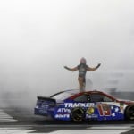 Martin Truex Jr. celebrates after winning the NASCAR Cup Series auto race at Charlotte Motor Speedway in Concord, N.C., Sunday, May 26, 2019.