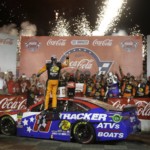 Martin Truex Jr. celebrates in Victory Lane after winning the NASCAR Cup Series auto race at Charlotte Motor Speedway in Concord, N.C., Sunday, May 26, 2019.