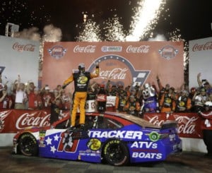 Martin Truex Jr. celebrates in Victory Lane after winning the NASCAR Cup Series auto race at Charlotte Motor Speedway in Concord, N.C., Sunday, May 26, 2019.
