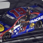Martin Truex Jr. celebrates after winning the NASCAR Cup Series auto race at Charlotte Motor Speedway in Concord, N.C., Sunday, May 26, 2019.