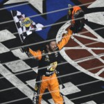 Martin Truex Jr. celebrates after winning the NASCAR Cup Series auto race at Charlotte Motor Speedway in Concord, N.C., Sunday, May 26, 2019.