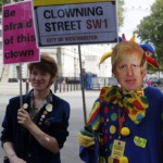 A protestor with a mask of Britain's Prime Minister Boris Johnson