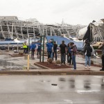 A Group Of People Stand Outside A Damaged Best Buy After A Tornado Touched Down Saturday, March 28, 2020