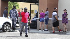 A Gun Owner Leaves The Shoot Straight Gun Store In Casselberry, Fla., Sunday, March 22, 2020