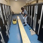 Custodian Joan Garner Washes The Floor In The Pool Locker Room At Orange High School, March 16, 2020, In Pepper Pike, Ohio