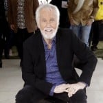 Kenny Rogers Poses With His Star On The Music City Walk Of Fame In Nashville, Tenn