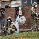 South African National Defense Forces Patrol The Men's Hostel In The Densely Populated Alexandra Township East Of Johannesburg, March 28, 2020