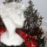 A Clock Atop The Belfry Of St. Demetrios Greek Orthodox Church Is Seen Through A Clothing Shop Window Pane With A Mannequin In The Foreground In Cyprus' Capital Nicosia