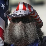 A Man Looks On During The Utah Business Revival Rally, Calling For Utah's Economy To Be Reopened, In Salt Lake City On Saturday, April 18, 2020