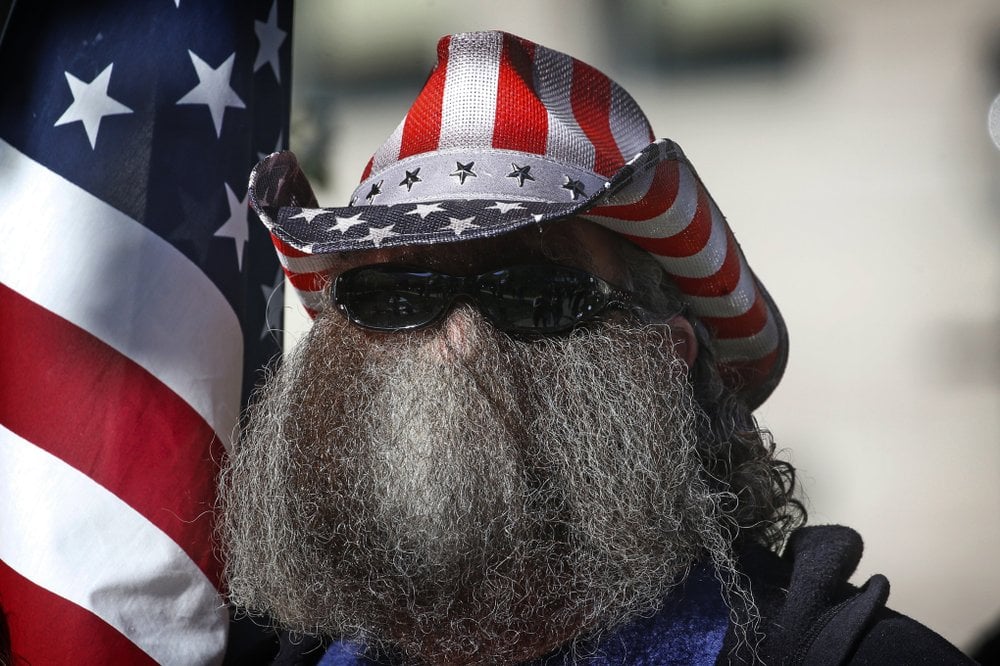 A Man Looks On During The Utah Business Revival Rally