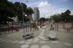A Man Sleeps On A Bench At A Deserted Playground Amid A Nationwide Quarantine To Slow The Spread Of The New Coronavirus, In Caracas, Venezuela