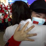 A Medical Worker From China's Jilin Province Reacts As She Prepares To Return Home At Wuhan Tianhe International Airport In Wuhan In Central China's Hubei Province, April 8, 2020