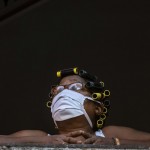 A Woman Wearing A Mask As A Precaution Against The Spread Of The New Coronavirus Cries From Her Window While She Watches Soldiers Clean The Streets With A Bleach Solution In Havana, Cuba,