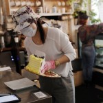 Assistant Manager Tiffany Wong Moves A Cake Onto A Smaller Plate At Clementine Bakery In The Brooklyn Borough Of New York
