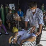 Emma Salvador, 84, Supplements Her Oxygen As Her Son Jose Gonzalez Watches Over Her In A Makeshift Tent Set Up At The 2 De Mayo Hospital To Treat People Who Are Infected With The New Coronavirus