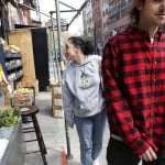 Managing Partner Derek Tigue, Left, Gives A Thumbs Up Sign To A Friend As Customers Leave The Fmn General Store