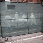 Medical Move A Body Behind A Fence At The Brooklyn Hospital Center, April 9, 2020, In The Brooklyn Borough Of New York