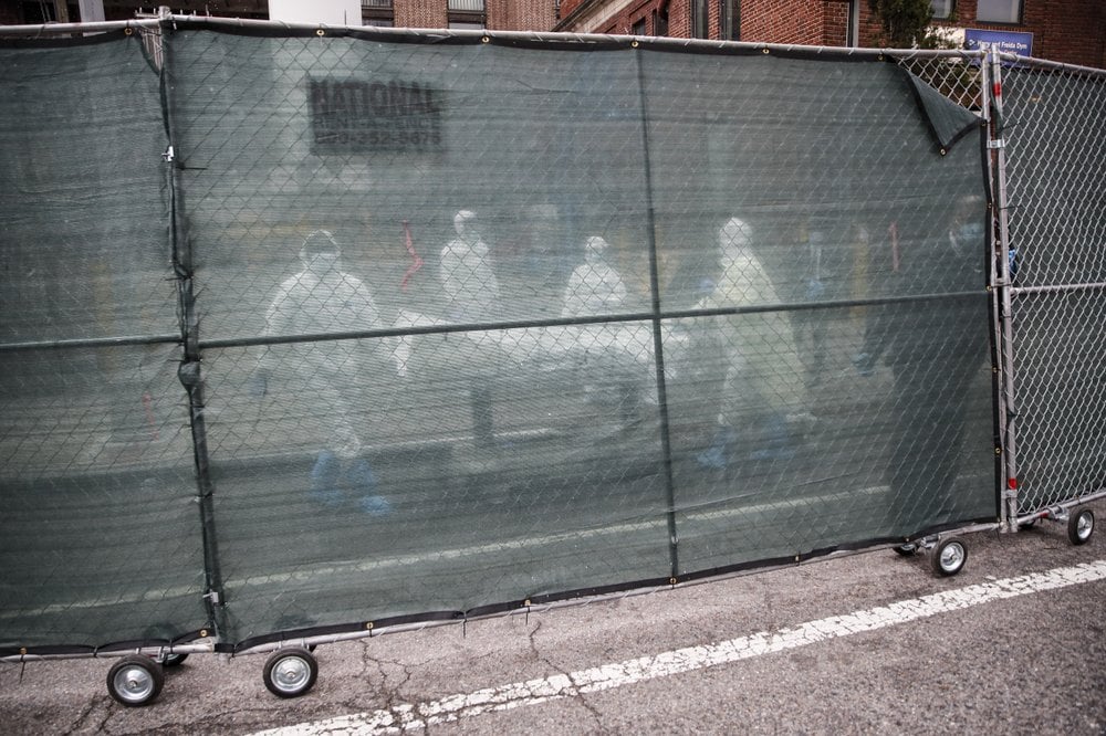 Medical Move A Body Behind A Fence At The Brooklyn Hospital Center, April 9, 2020, In The Brooklyn Borough Of New York