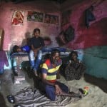 Rajesh Dhaikar Sits Idle With Children In His Small House, In Prayagraj, India, April 5, 2020.